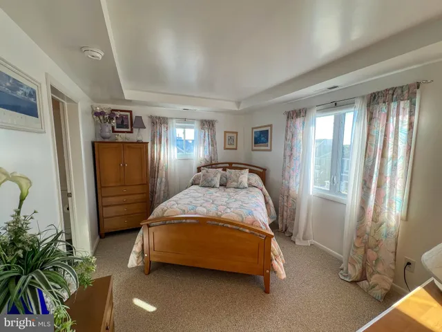 a bed room with a bed and a window