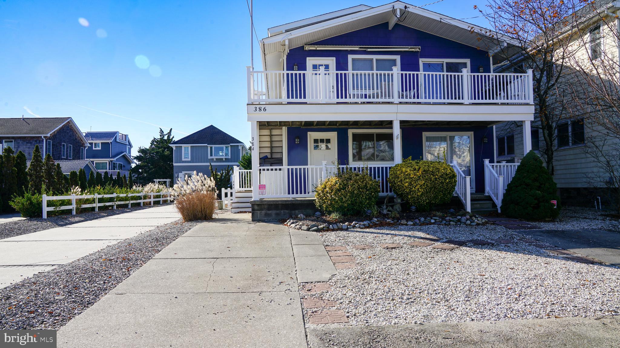 386 24th Street Avalon, NJ 08202 - Photo 2 of 32 a view of a house with a yard and plants