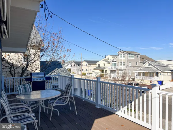 a view of a chairs and table in patio
