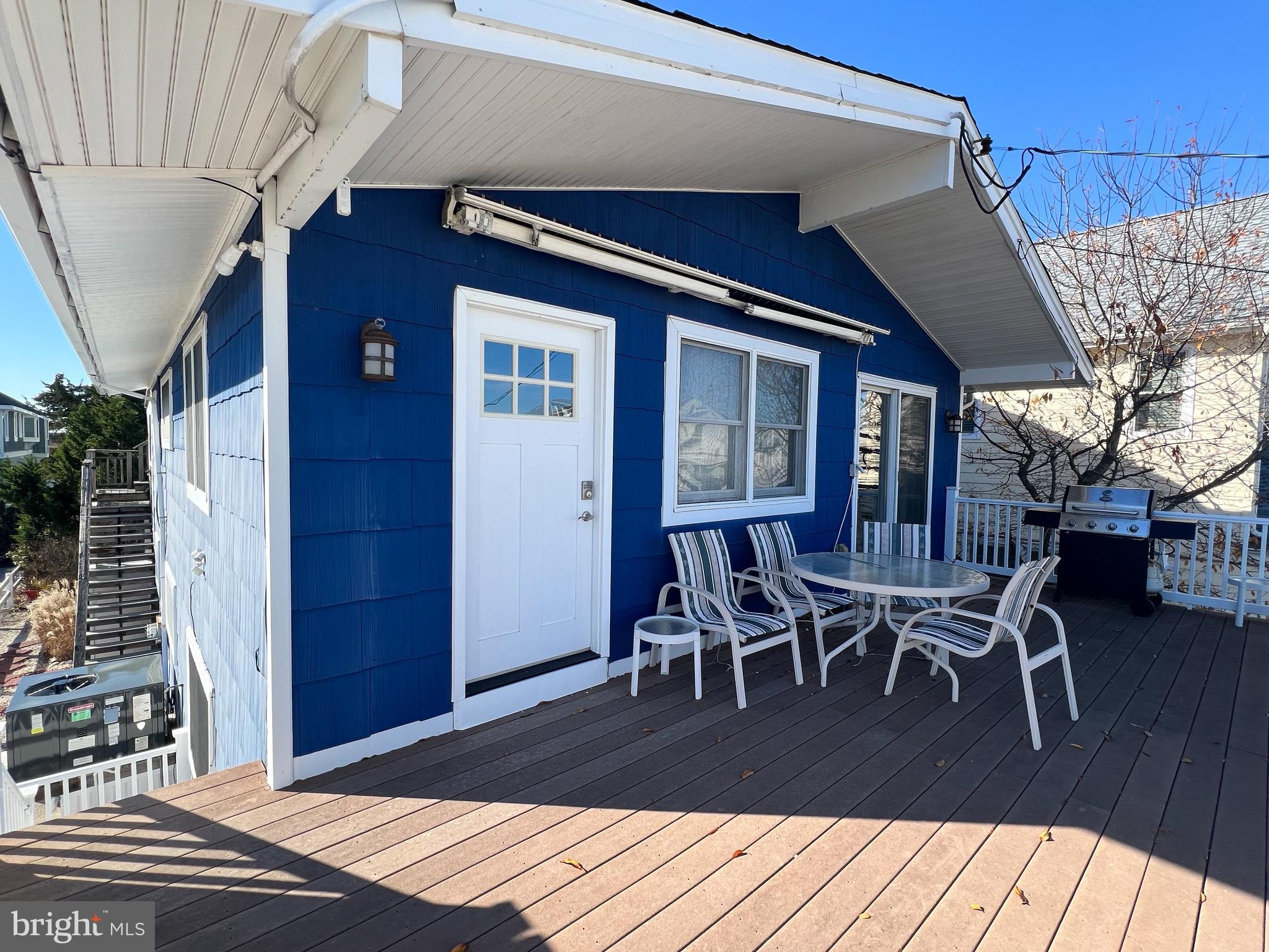 386 24th Street Avalon, NJ 08202 - Photo 22 of 32 a view of a dinning table and chairs in patio of the house