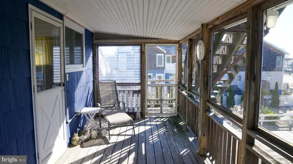a view of balcony with furniture