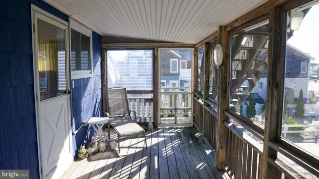 a view of balcony with furniture