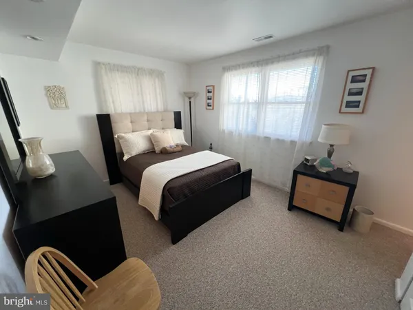 a bedroom with bed and window