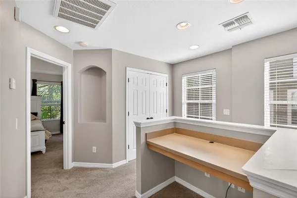 a view of a kitchen with a tub and windows