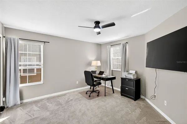 a view of a livingroom with furniture and a window
