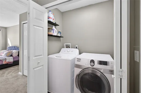 a utility room with dryer and washer