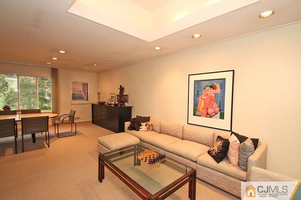 32 Clive Hills Road Edison, NJ 08820 - Photo 3 of 25 a living room with furniture and a large window