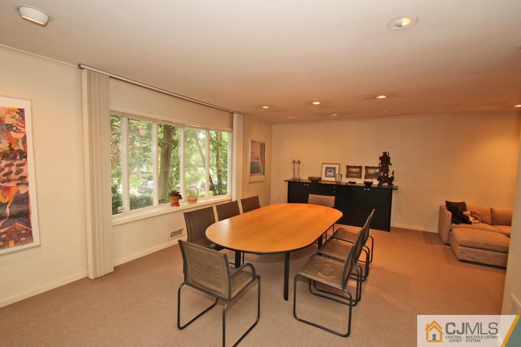 32 Clive Hills Road Edison, NJ 08820 - Photo 4 of 25 a view of a workspace with furniture and a window