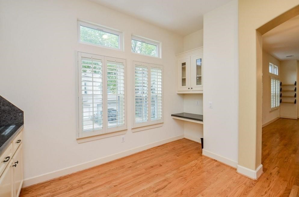 5416 Rose Street Houston, TX 77007 - Photo 14 of 19 Built-in corner desk with cabinet storage.