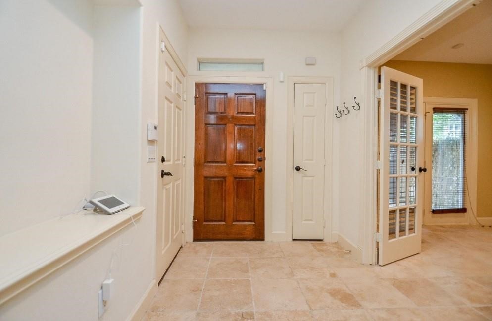 5416 Rose Street Houston, TX 77007 - Photo 4 of 19 Primary wooden entrance, plus a convenient door to the garage.