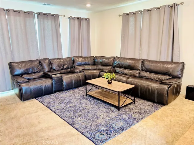 a living room with furniture and a couch