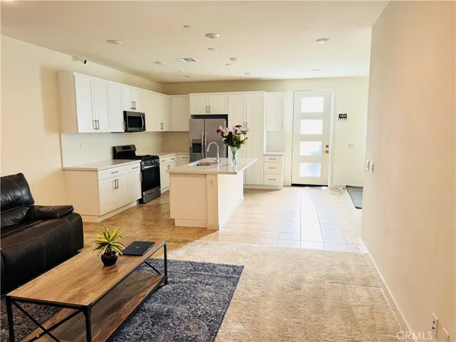 a living room with furniture and a rug