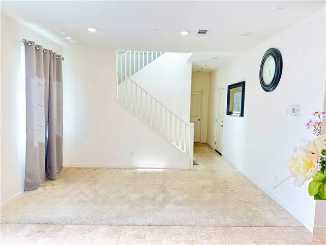 a view of a hallway view with staircase