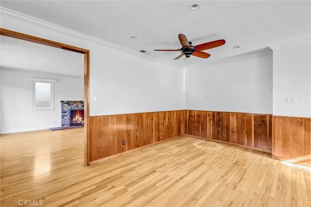 a kitchen with stainless steel appliances kitchen island granite countertop a refrigerator and a stove top oven