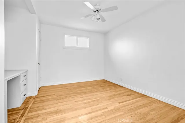 a big room with closet and windows