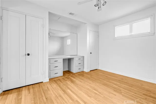 a view of a house with a tree and plants