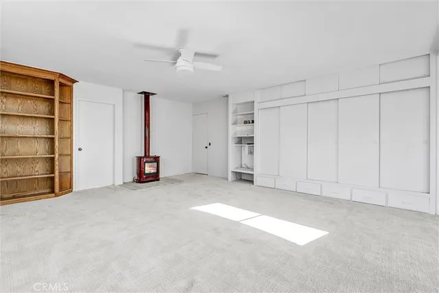 a bathroom with a granite countertop sink a mirror and a shower