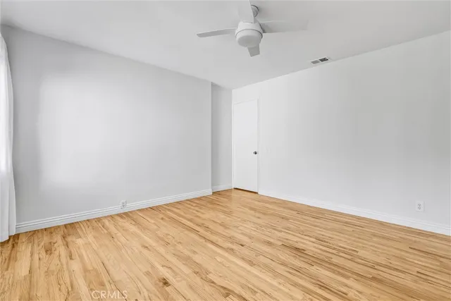 a bathroom with a tub sink toilet and mirror