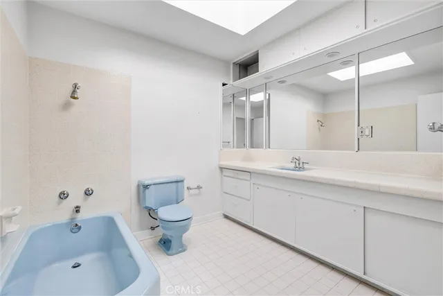 a view of a house with swimming pool and sitting area