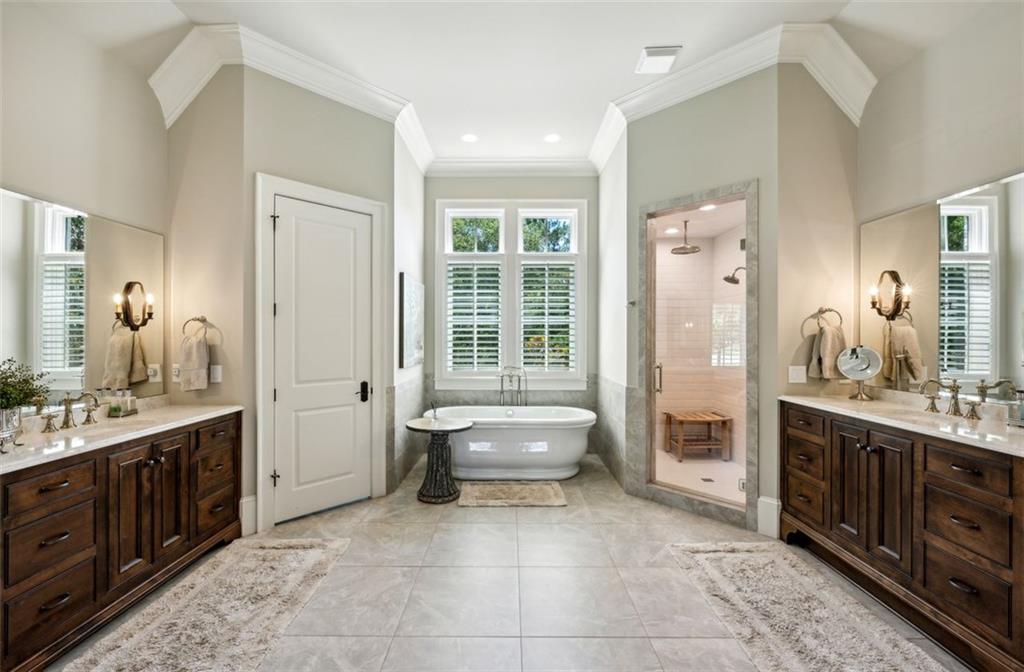 1990 Elder Mill Road Watkinsville, GA 30677 - Photo 15 of 61 a spacious bathroom with a tub sink and mirror