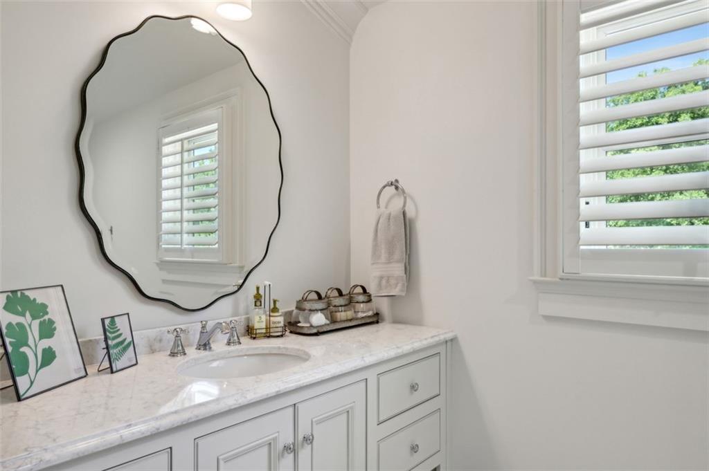 1990 Elder Mill Road Watkinsville, GA 30677 - Photo 19 of 60 a bathroom with a granite countertop sink and a mirror