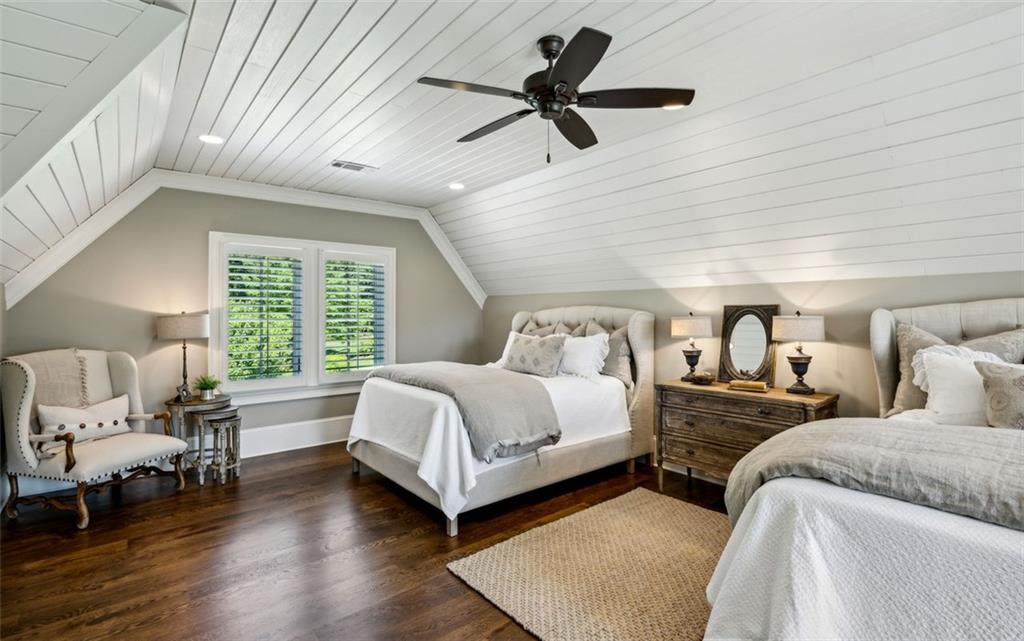 1990 Elder Mill Road Watkinsville, GA 30677 - Photo 20 of 60 a bedroom with a bed a couch and a large window