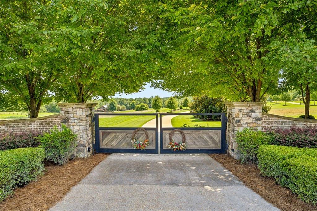 1990 Elder Mill Road Watkinsville, GA 30677 - Photo 3 of 61 a view of swimming pool with a outdoor seating