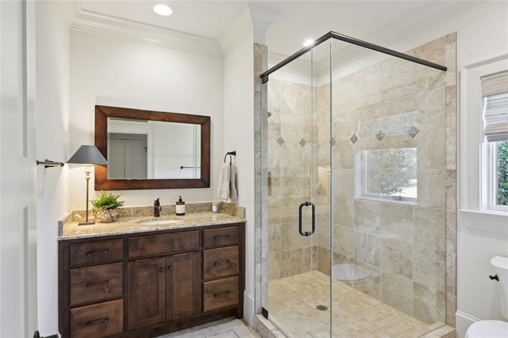 1990 Elder Mill Road Watkinsville, GA 30677 - Photo 46 of 60 a bathroom with a double vanity sink mirror and shower