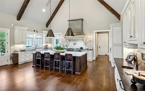 a open kitchen with stainless steel appliances granite countertop a stove and cabinets