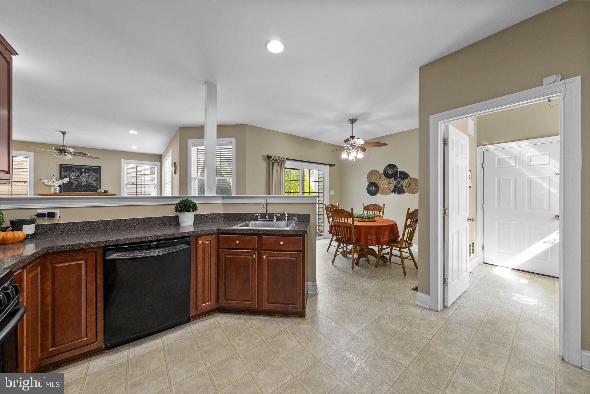117 George Street Robbinsville, NJ 08691 - Photo 13 of 55 a kitchen with a sink and chairs