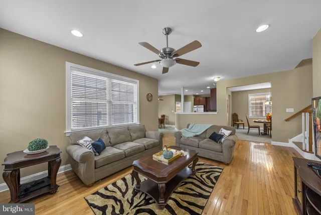 a living room with furniture fireplace and flat screen tv