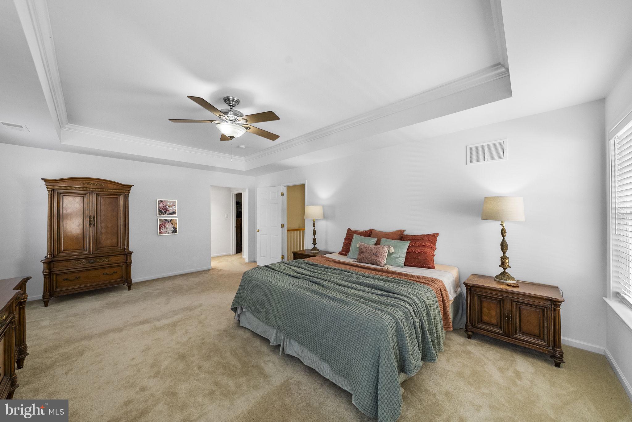 117 George Street Robbinsville, NJ 08691 - Photo 29 of 55 a bedroom with a bed and a ceiling fan