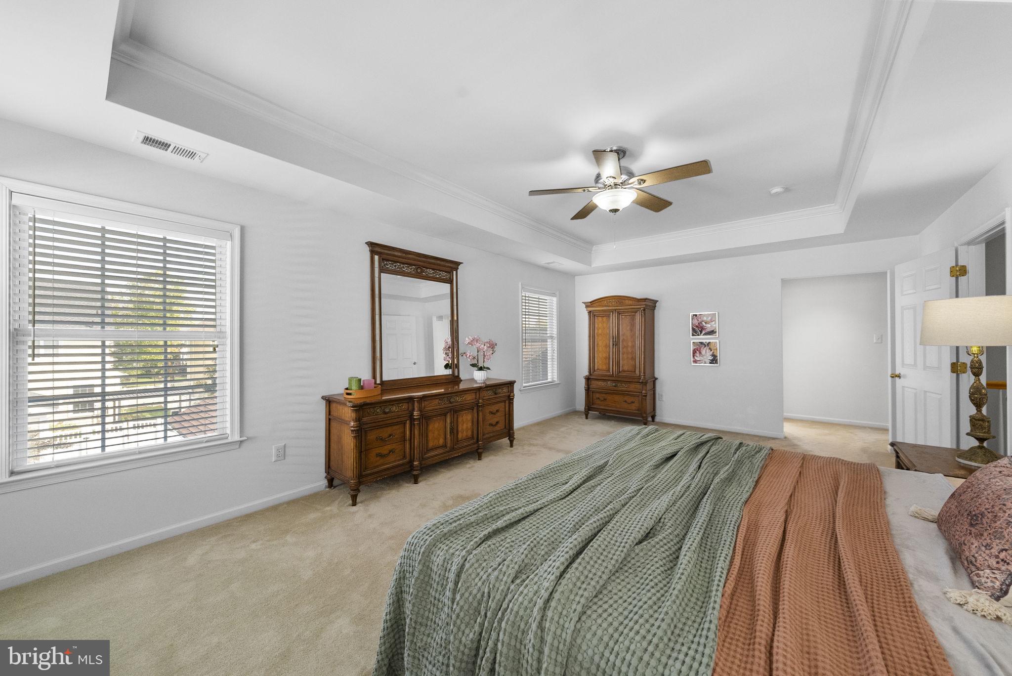 117 George Street Robbinsville, NJ 08691 - Photo 30 of 55 a spacious bedroom with a bed and a chandelier
