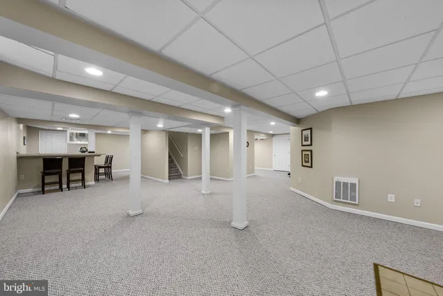 a view of a house with a yard and garage