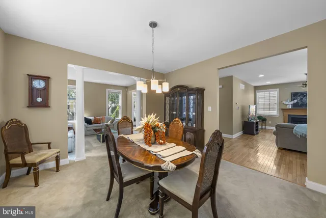 a kitchen with stainless steel appliances granite countertop a stove top oven a sink dishwasher a refrigerator and a microwave