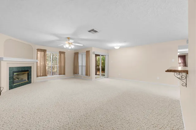 a view of a livingroom and a fireplace