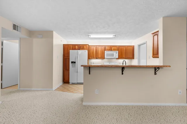 a view of a kitchen with a sink