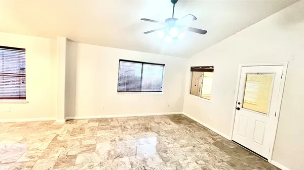 a view of a bathroom with a sink and natural light