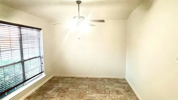 a kitchen with stainless steel appliances kitchen island granite countertop a refrigerator and a stove