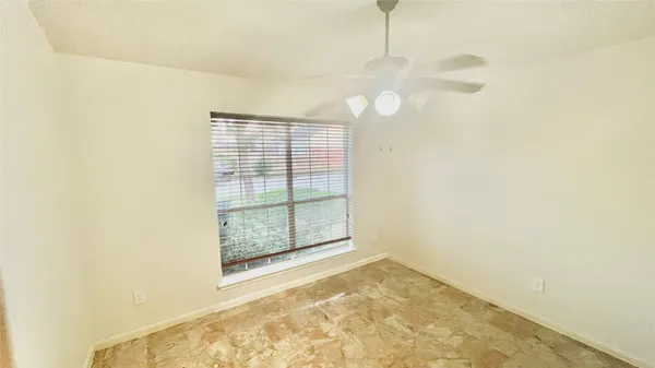 a large kitchen with stainless steel appliances granite countertop a stove a sink and a refrigerator