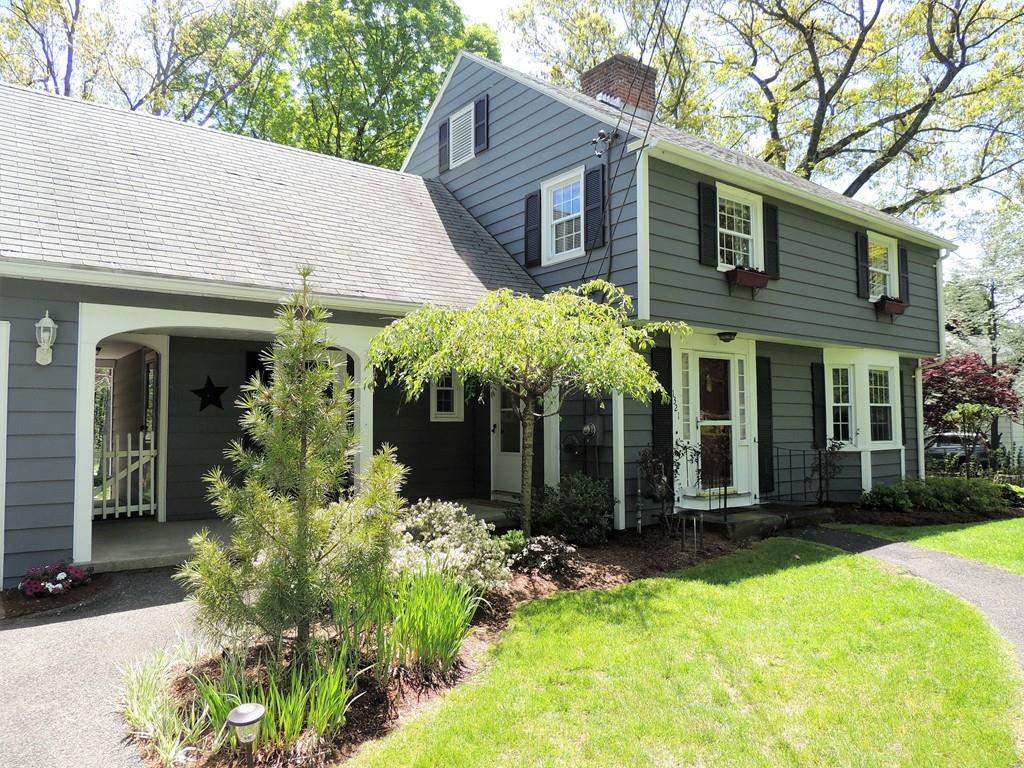 1321 Plumtree Road Springfield, MA 01119 - Photo 1 of 36 a view of a house with potted plants and a table and chairs