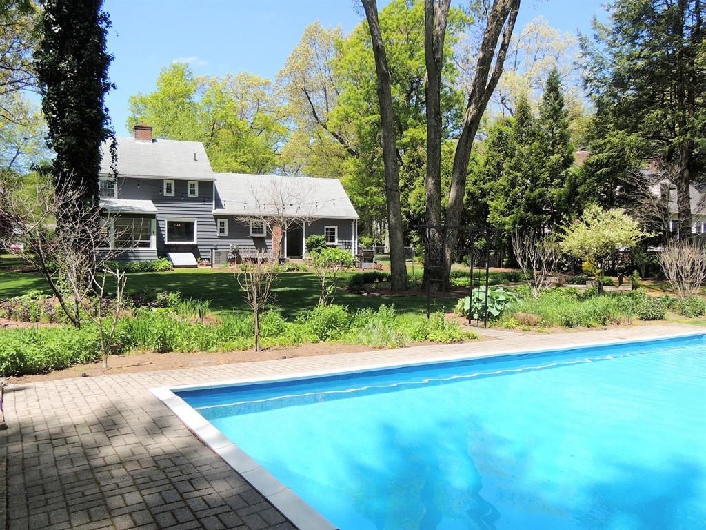 1321 Plumtree Road Springfield, MA 01119 - Photo 14 of 36 a front view of a house with a yard and trees