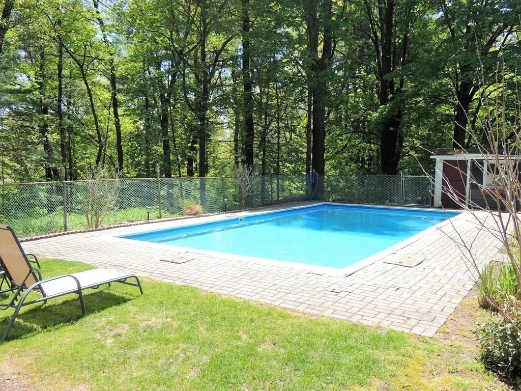 1321 Plumtree Road Springfield, MA 01119 - Photo 15 of 36 a view of a swimming pool with a yard and sitting area