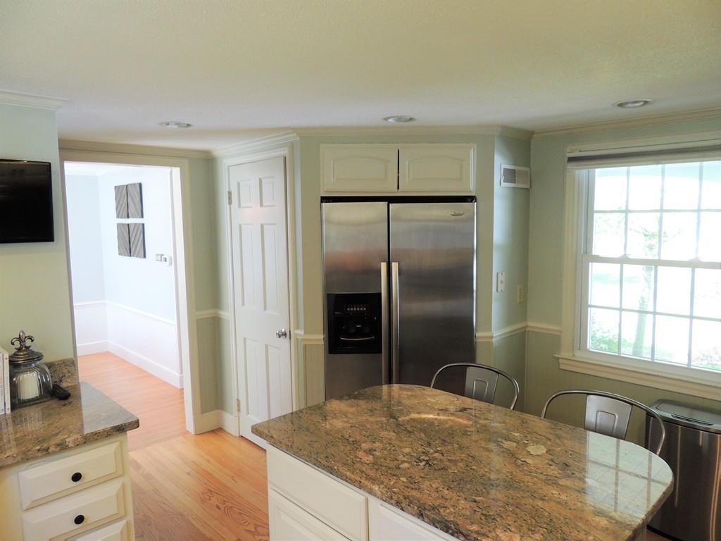 1321 Plumtree Road Springfield, MA 01119 - Photo 17 of 36 a living room with stainless steel appliances kitchen island granite countertop a refrigerator and a sink