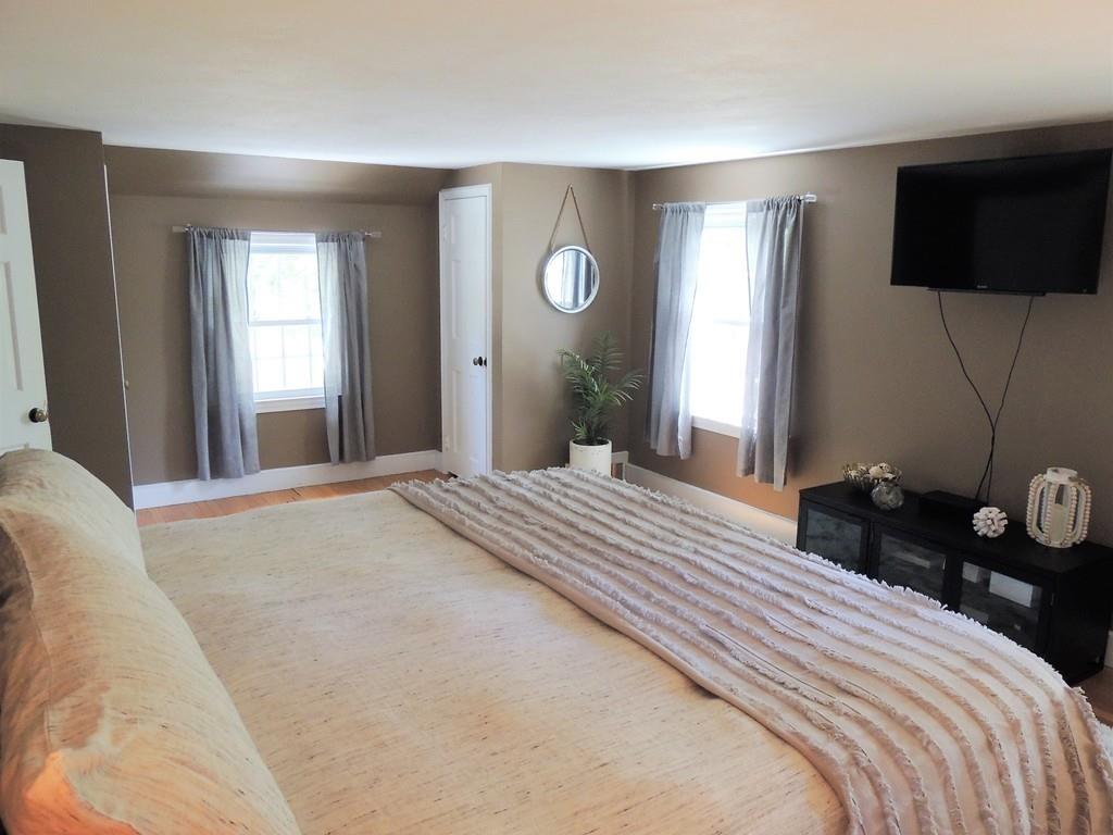 1321 Plumtree Road Springfield, MA 01119 - Photo 28 of 36 a bedroom with a bed and a flat screen tv
