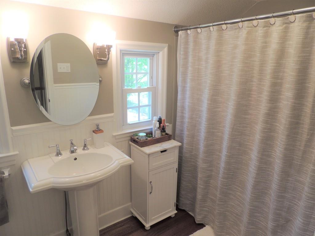1321 Plumtree Road Springfield, MA 01119 - Photo 34 of 36 a bathroom with a sink and mirror