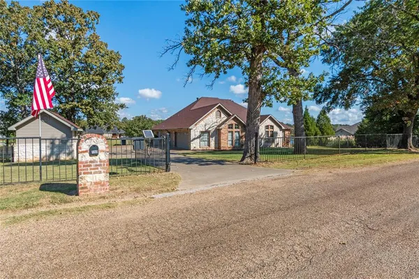 a house with trees in the background