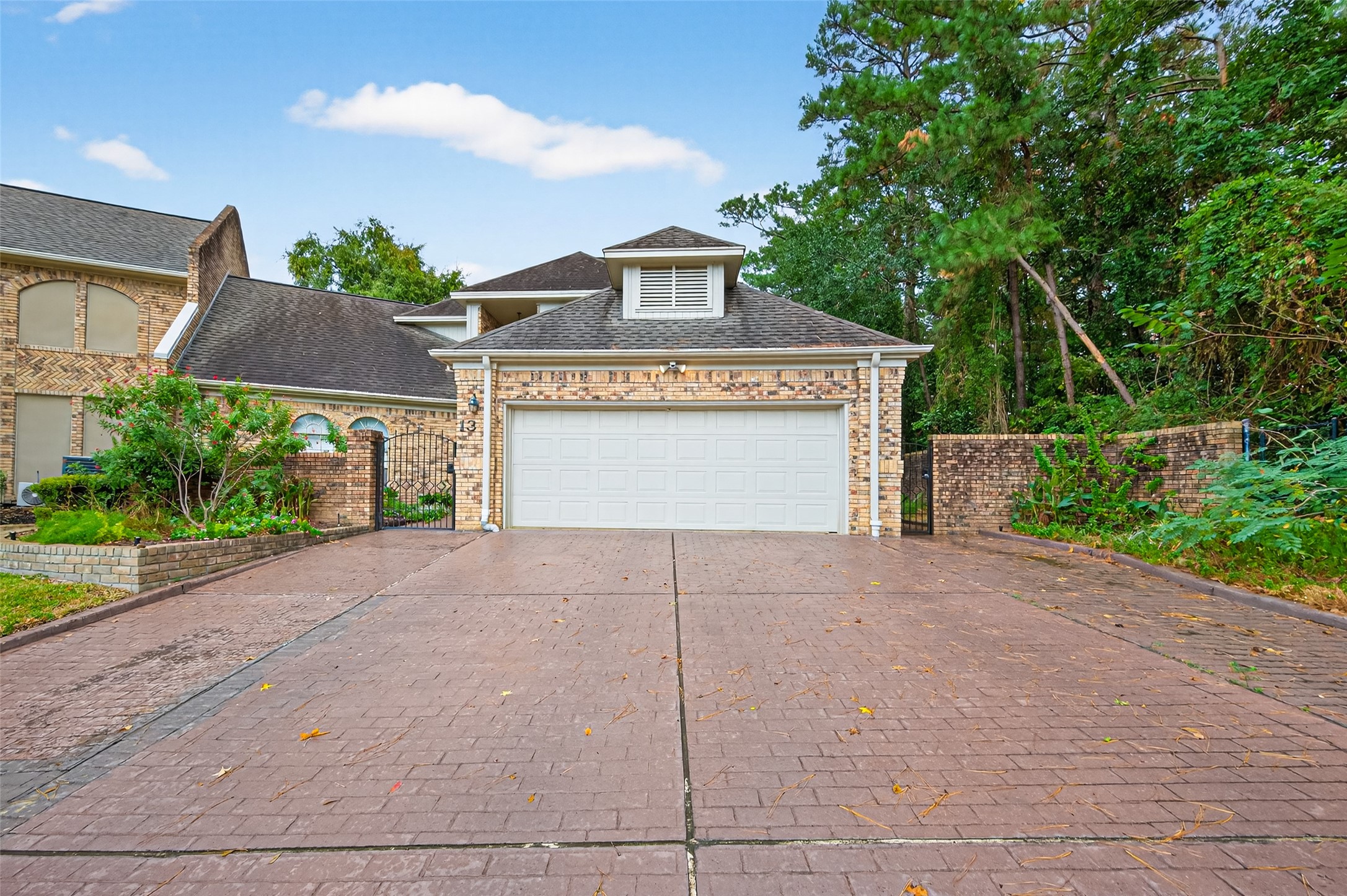 901 Longmire Road, Unit 13 Conroe, TX 77304 - Photo 1 of 46 a view of outdoor space garage and basketball court