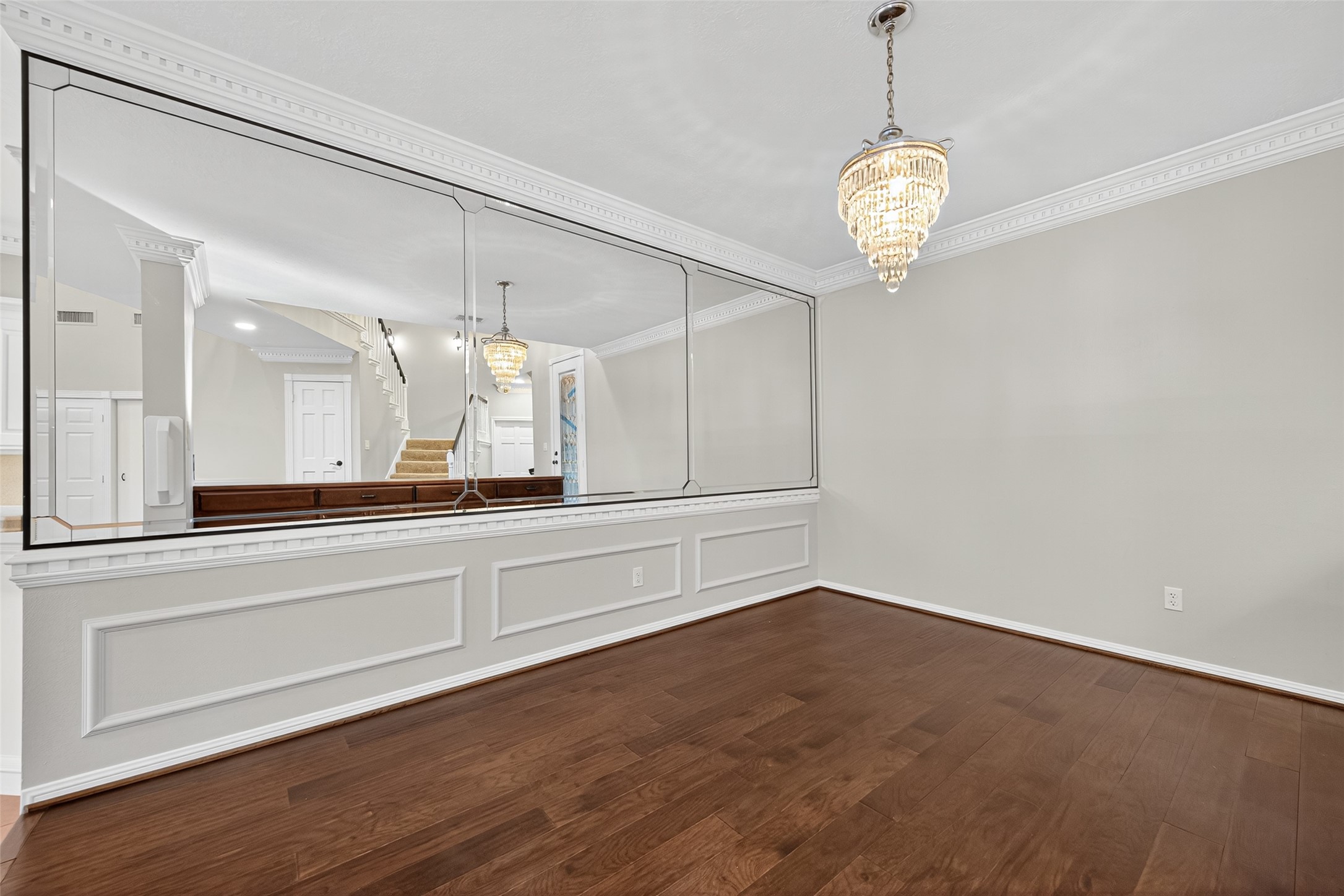901 Longmire Road, Unit 13 Conroe, TX 77304 - Photo 12 of 46 a view of a room with wooden floor and staircase