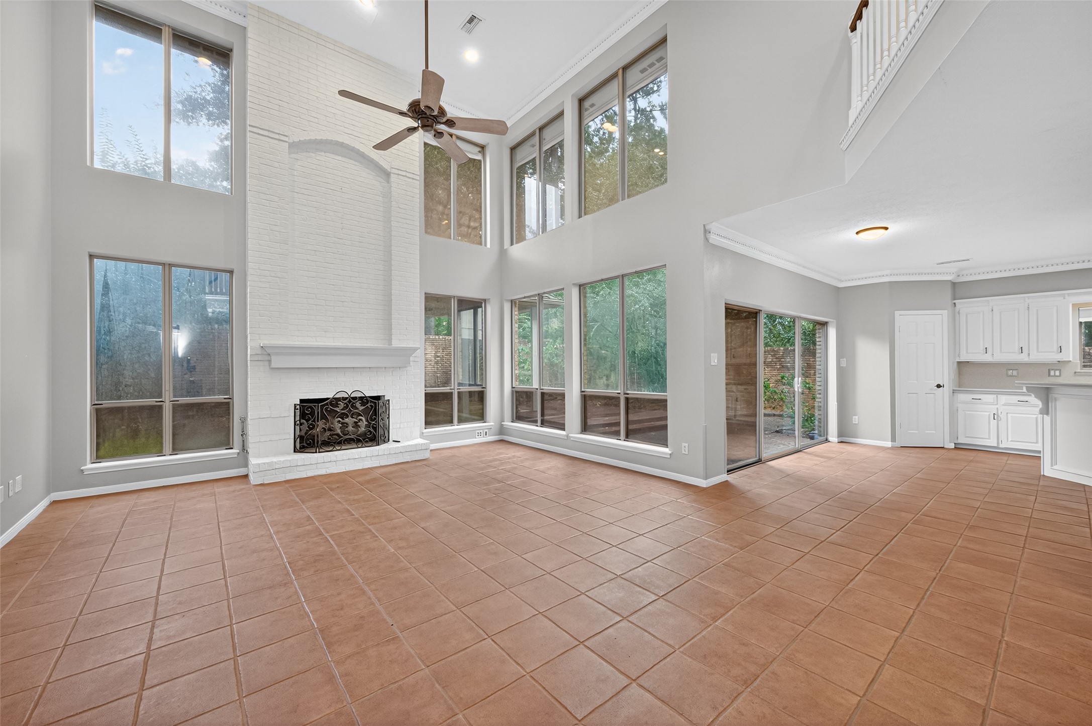 901 Longmire Road, Unit 13 Conroe, TX 77304 - Photo 13 of 46 a view of an empty room with a fireplace and a window